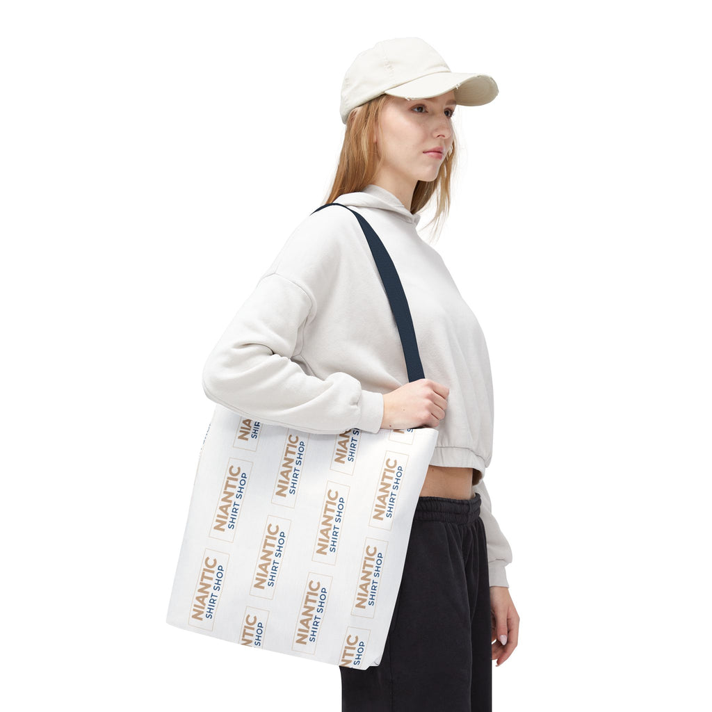 Person holding a pastel geometric patterned bag on a white background