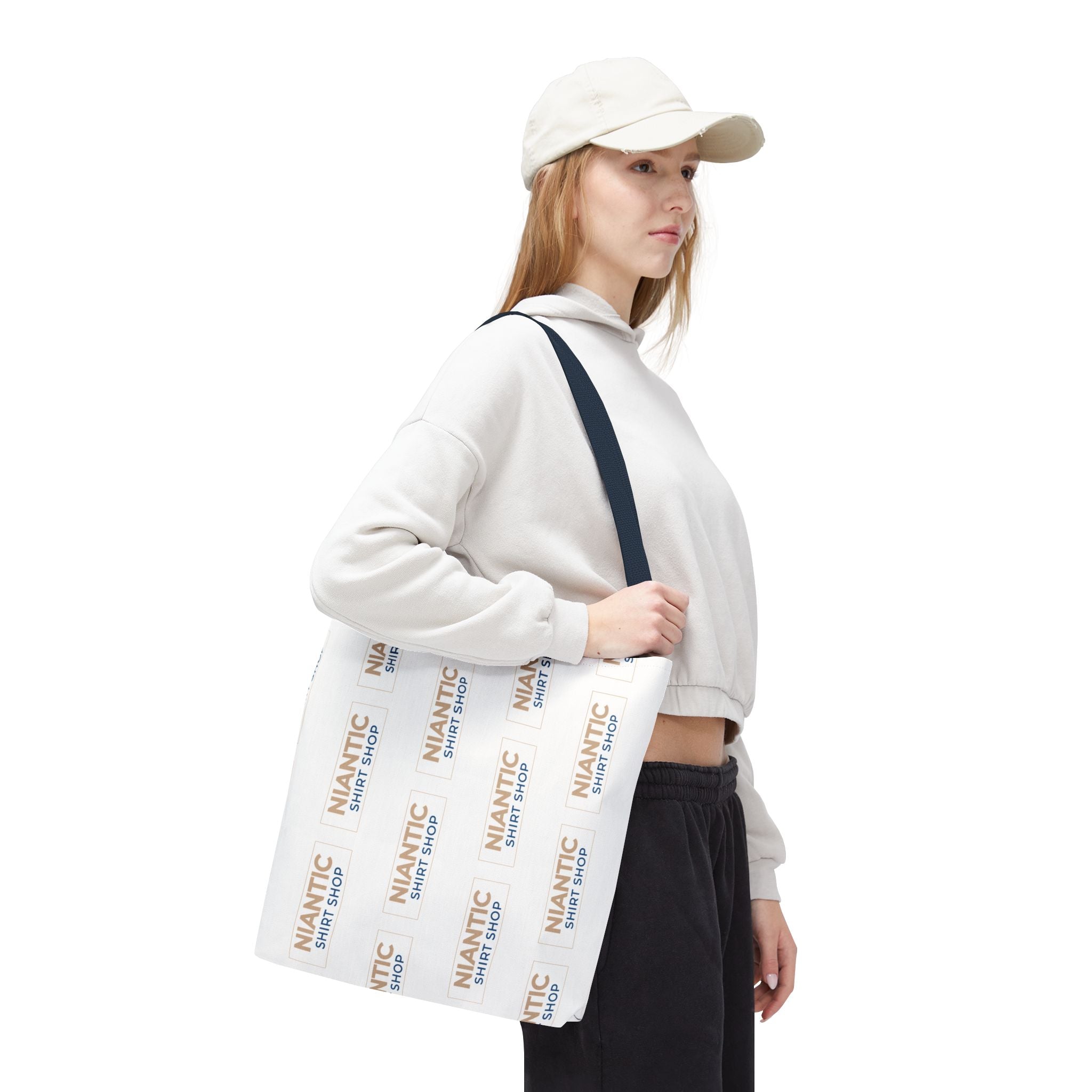 Person holding a pastel geometric patterned bag on a white background